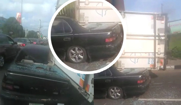 Motorist escapes death as a container from trailer falls on Toyota Camry in Lagos