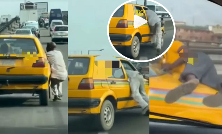 Reactions as two men cling to a moving car in order to settle score with the driver